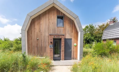 Belle villa neuve avec sauna entourée d’une réserve de dunes près de la mer